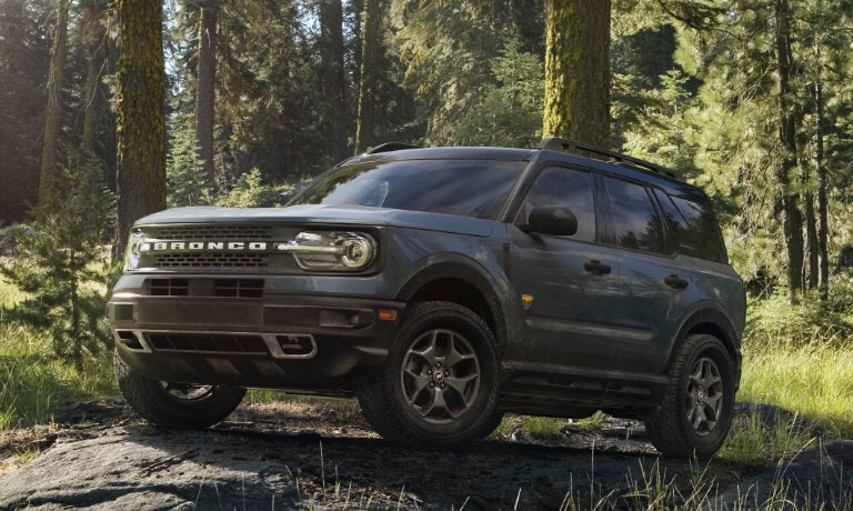 2024 Ford Bronco Sport driving through a dark forest