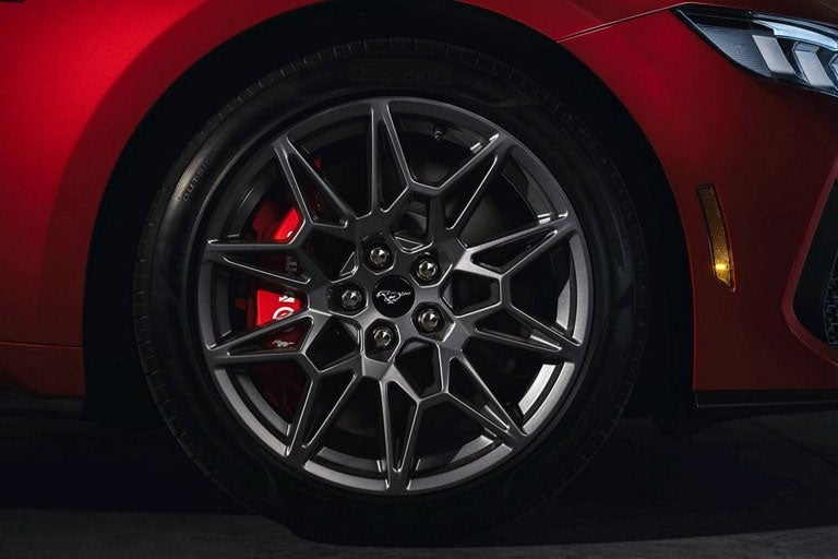 2024 Ford Mustang® model with a close-up of a wheel and brake caliper | Tubbs Brothers Ford Inc in Sandusky MI