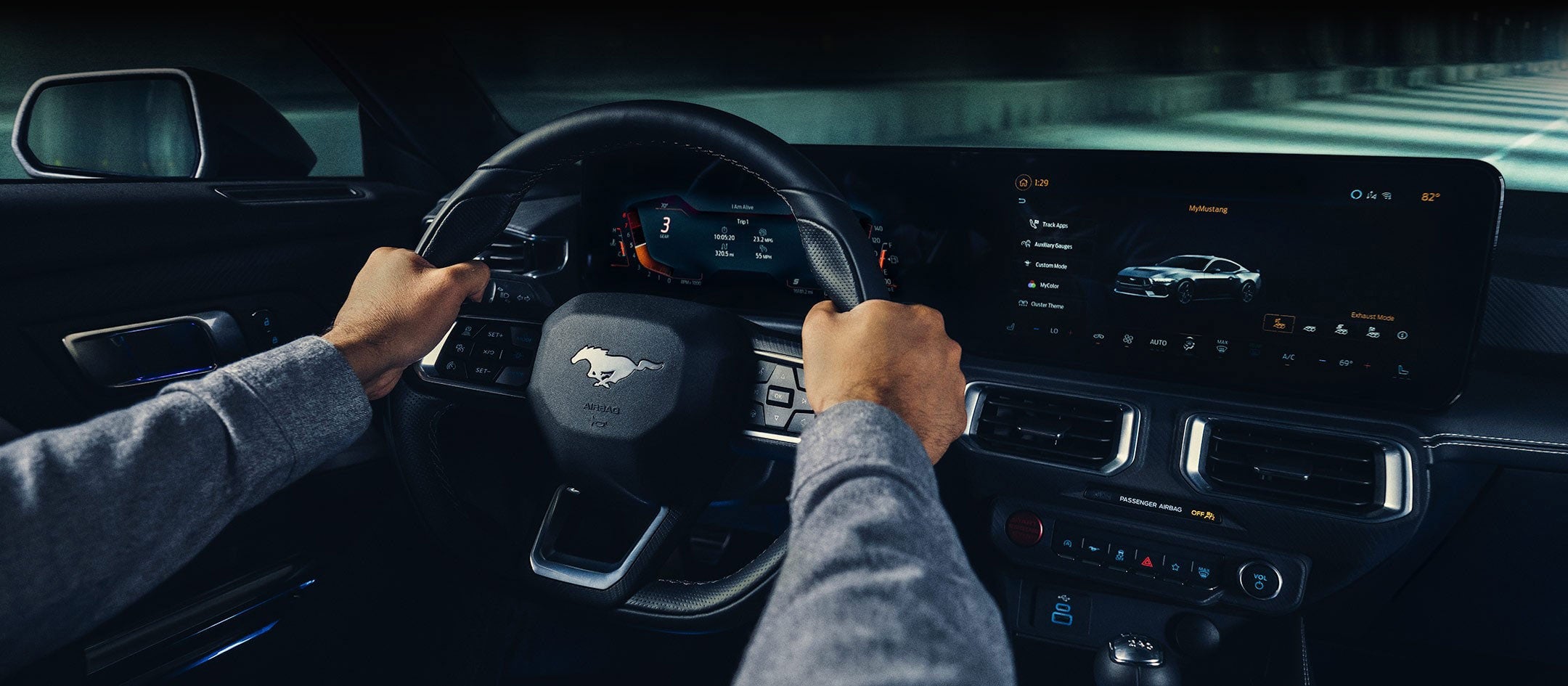 A 2024 Ford Mustang® model interior with a person driving | Tubbs Brothers Ford Inc in Sandusky MI