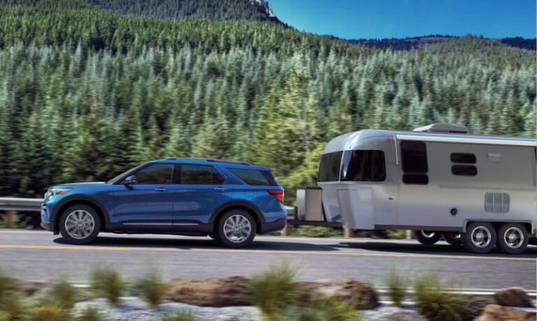 2023 Ford Explorer towing a trailer across a national park