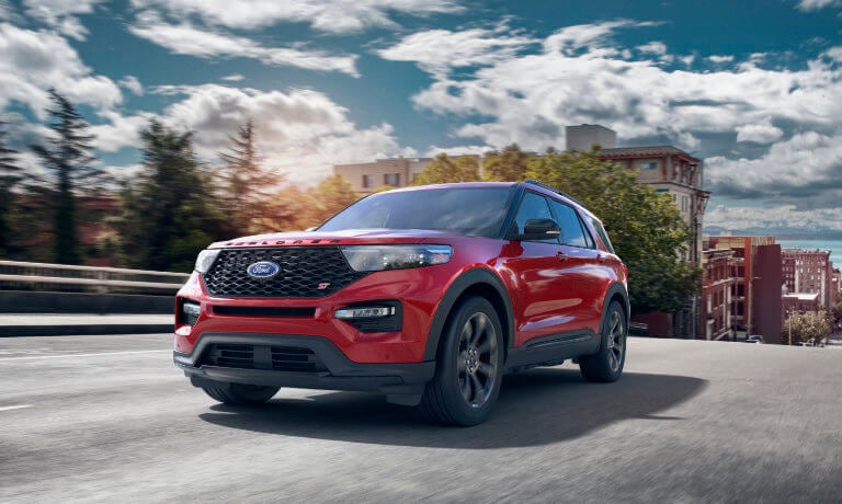 2023 Ford Explorer parked near a modern home