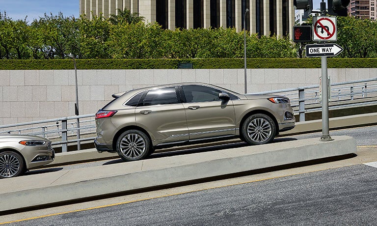2024 Ford Edge driving in a busy city