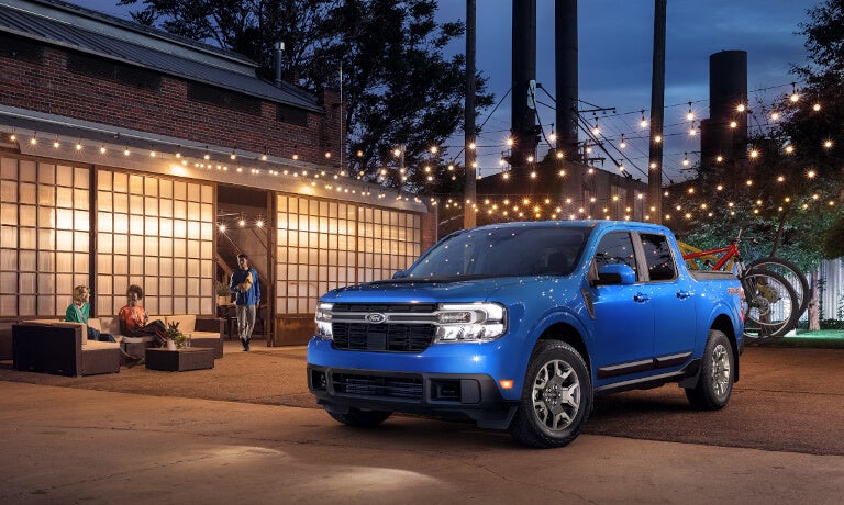 2024 Ford Maverick parked near a modern home